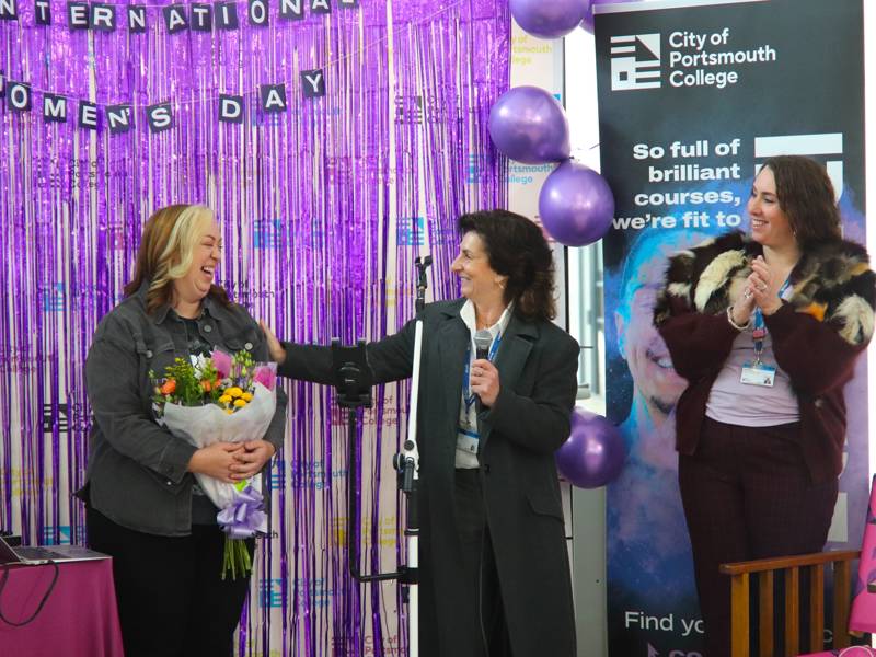 Amba Tremain performing for International Women's Day at City of Portsmouth College. 