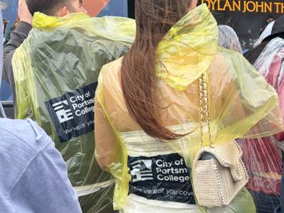 City of Portsmouth College ponchos keep festivalgoers dry