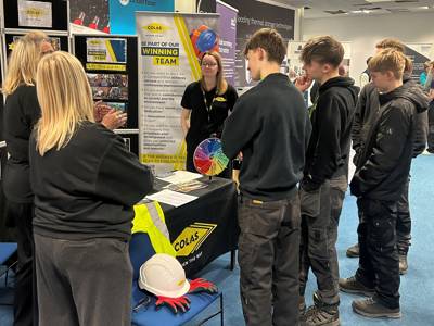 Students chatting to staff from Colas at the Construction Careers Fair