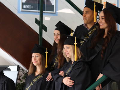 ESOL Level 2 graduates pose with pride