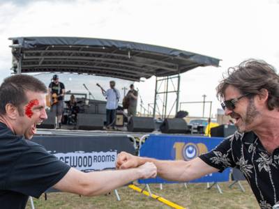 Two people fist-bumping at SENtury Festival