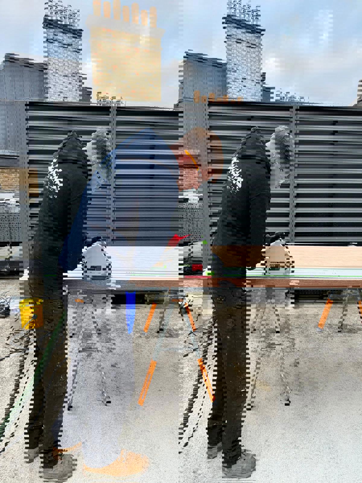 A property maintenance apprentice from COPC on site with Isle Contracts 