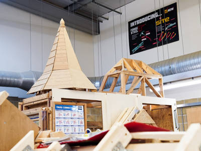 Roofing trusses and wooden structures in a woodwork workshop at City of Portsmouth College 