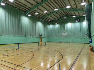 Highbury Campus indoor sports hall with badminton nets, basketball hoops and a five-a-side goal