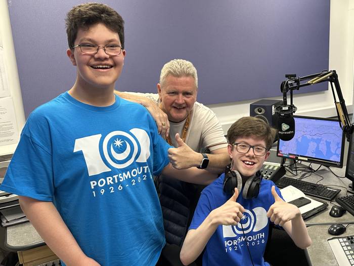 Students Daniel Runham and James Rogers at the Express FM mixing desk with presenter Ian James