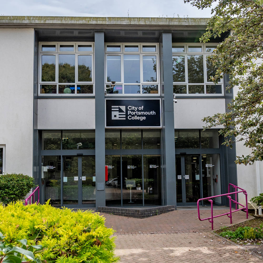 Sixth Form Campus exterior at City of Portsmouth College featuring main entrance, accessible pathways and surrounding greenery.