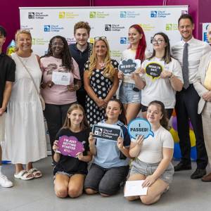 Students pose for a celebratory photo with Katy Quinn, Principal and CEO, MPs Amanda Martin and Stephen Morgan, and chair of governors, Tim Jackson OBE 