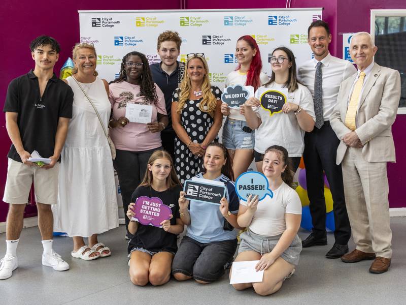 Students pose for a celebratory photo with Katy Quinn, Principal and CEO, MPs Amanda Martin and Stephen Morgan, and chair of governors, Tim Jackson OBE