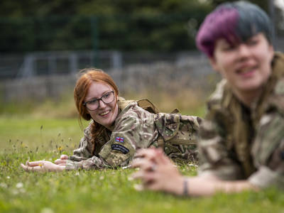 Students doing Army training at City of Portsmouth College on a field 
