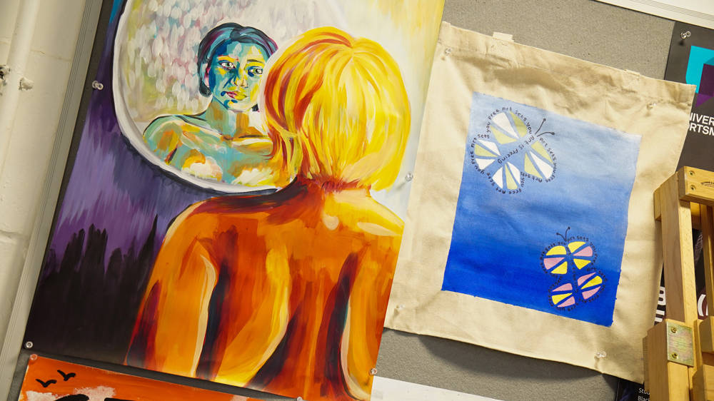 Close up of student surrealist artwork hung in studio