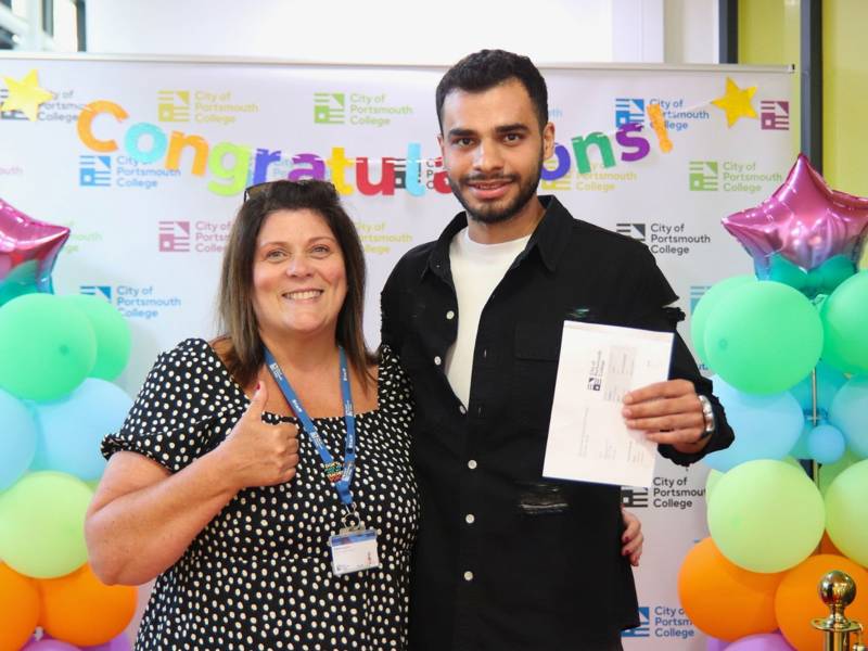 English teacher Debbie Hughes celebrates with her student, Rasoul Ebrahim