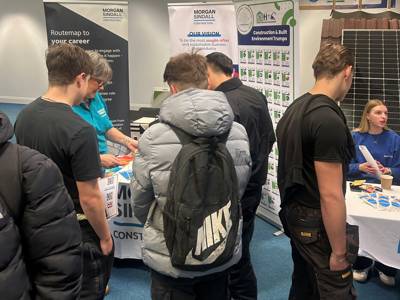 Students chatting to staff from Morgan Sindall at the Construction Careers Fair 