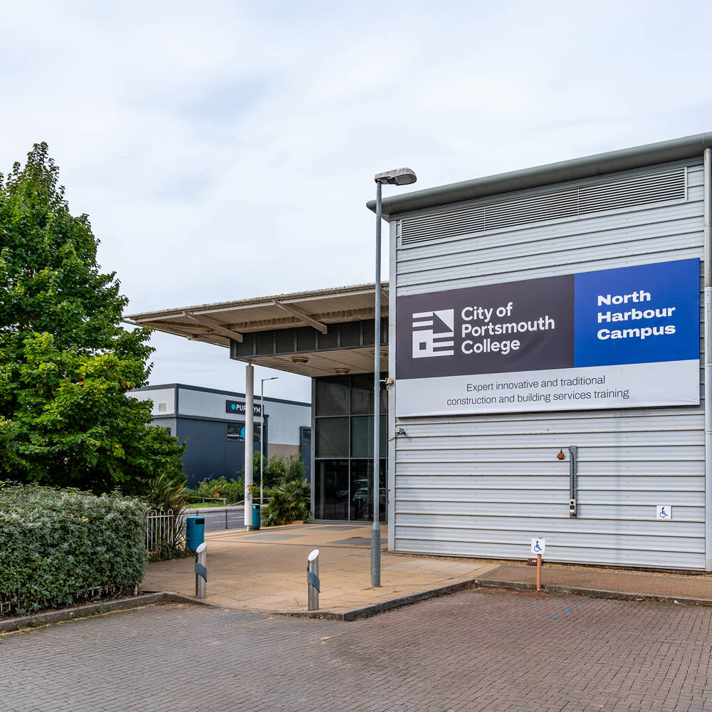 North Harbour Campus exterior at City of Portsmouth College showing specialist construction facilities and main entrance signage.