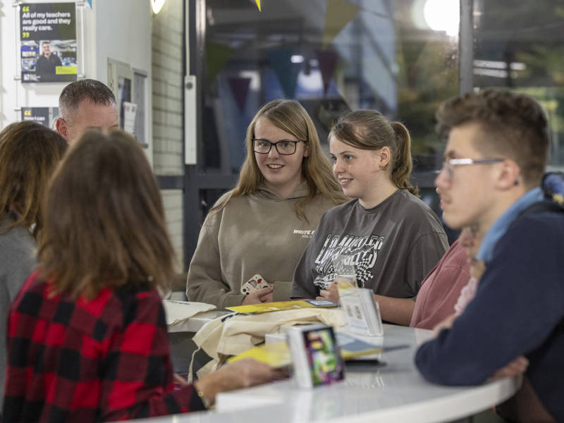 Happy students being welcomed to City of Portsmouth College's Open Event 