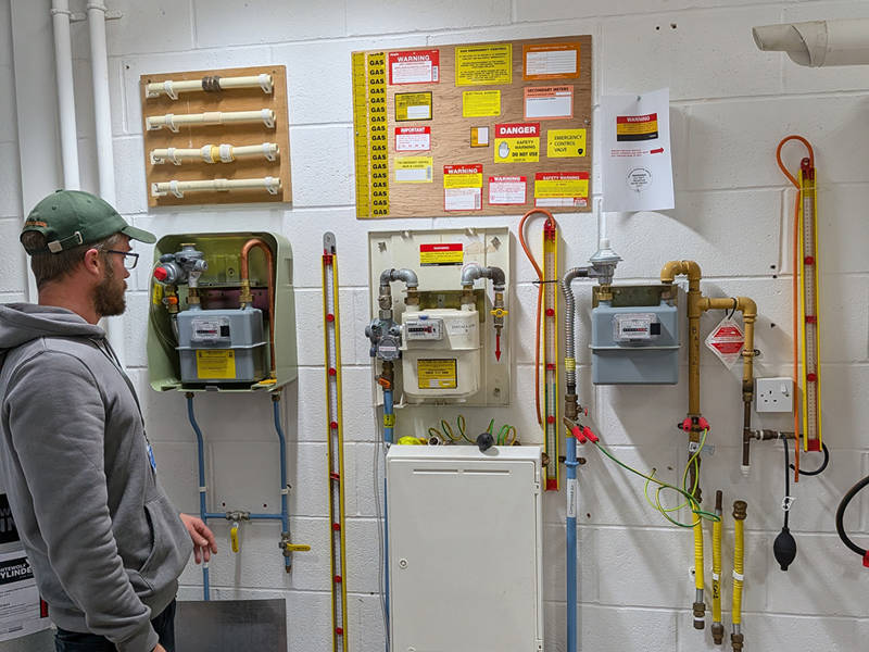 A gas trainee interacting with a gas system.