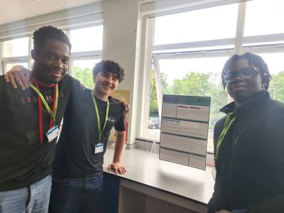 Physics students with their presentation 