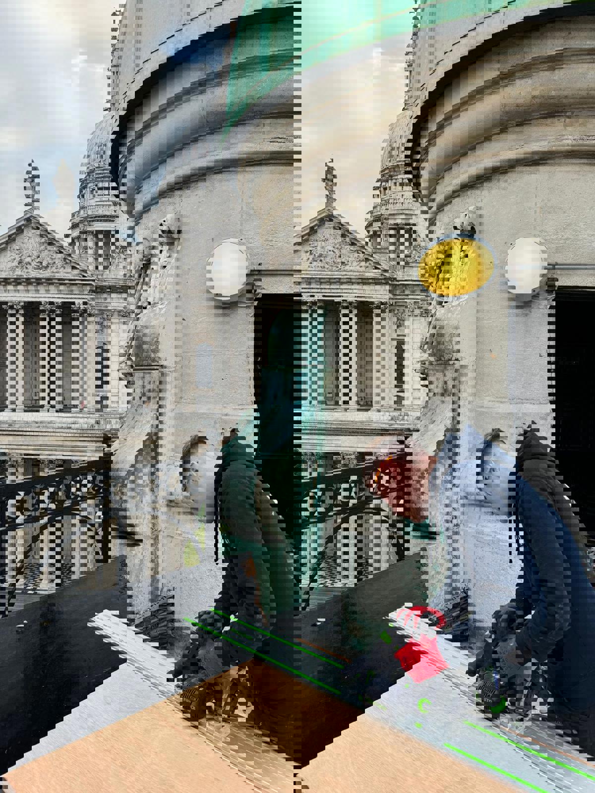 A property maintenance apprentice from COPC working on a rooftop in London