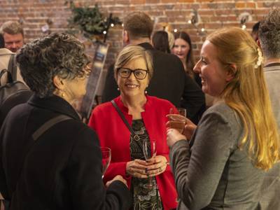 Sixth Form Campus head Emily Pountney, left, chatting with guests at the COPC x Unloc dinner