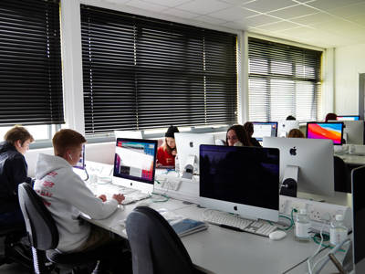 Students using the Mac suite at City of Portsmouth College 