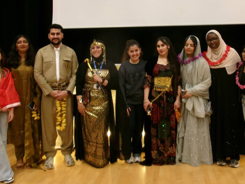 Students and staff - some in their traditional dress - pose for COPC's Culture Day 2026