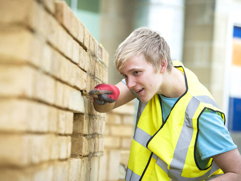 Bricklaying student works in the brick workshop at North Harbour Campus