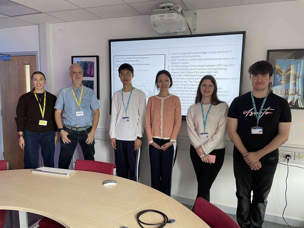 A group of students present their work to NATS and ONS