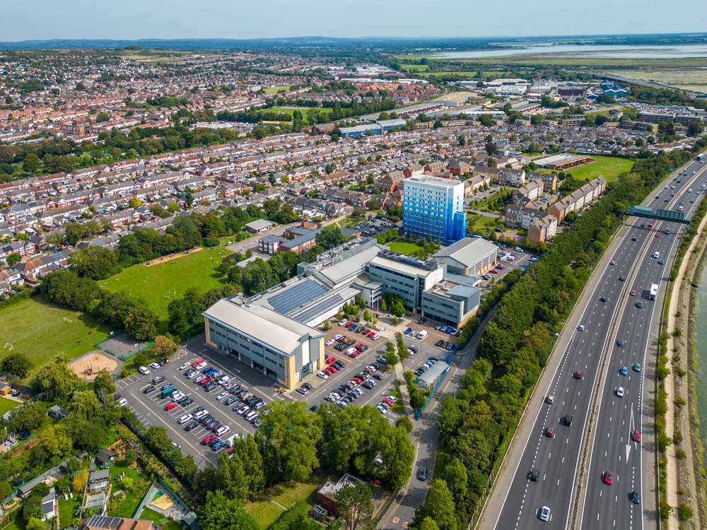 An arial view of City of Portsmouth College's Highbury Campus and it's proximity to the A27 and Cosham.