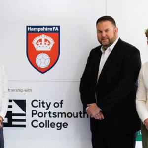 Steve Powell and Louis Allman from COPC with Neil Cassar, CEO of Hampshire FA at the unveiling of the partnership