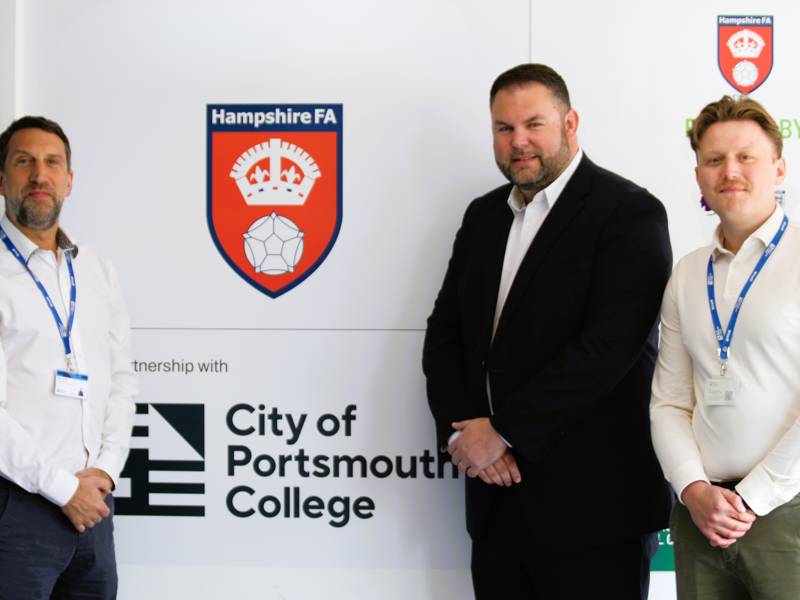Steve Powell and Louis Allman from COPC with Neil Cassar, CEO of Hampshire FA at the unveiling of the partnership