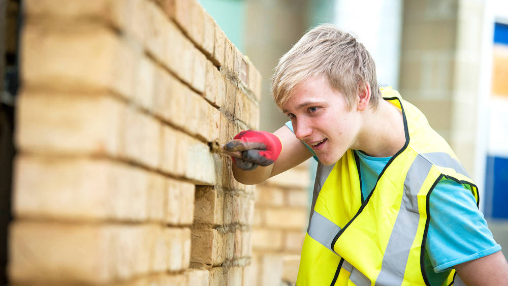 Bricklaying student works in the brick workshop at North Harbour Campus