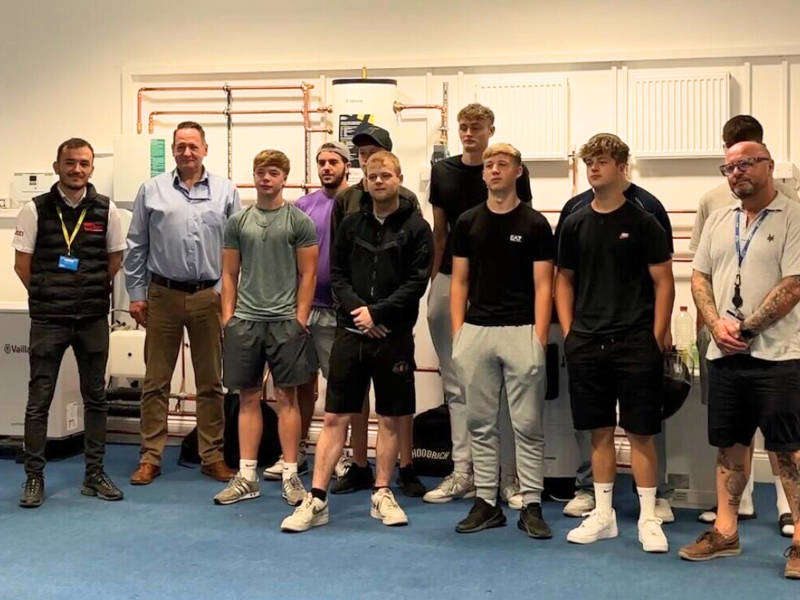 Isni Basha from Wilten Construction, far left, with staff and students from City of Portsmouth College