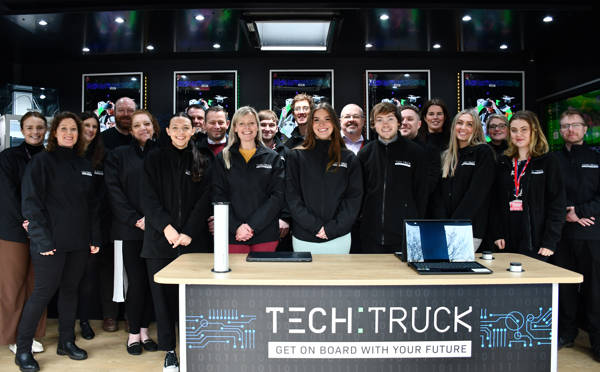 Tech Truck instructors stood smiling in the Tech Truck.