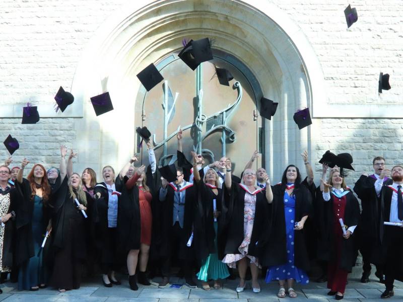 City of Portsmouth College higher education graduates celebrate outside Portsmouth Cathedral