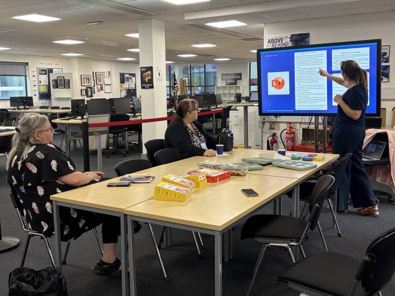 A staff members gives a presentation to colleagues at the ATTL