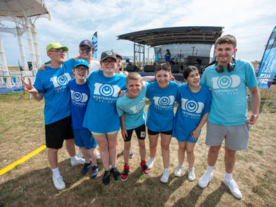 A group of flashmob dancers pose together at SENtury Festival