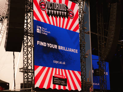 Victorious 2025 - the City of Portsmouth College advert playing on the big screen