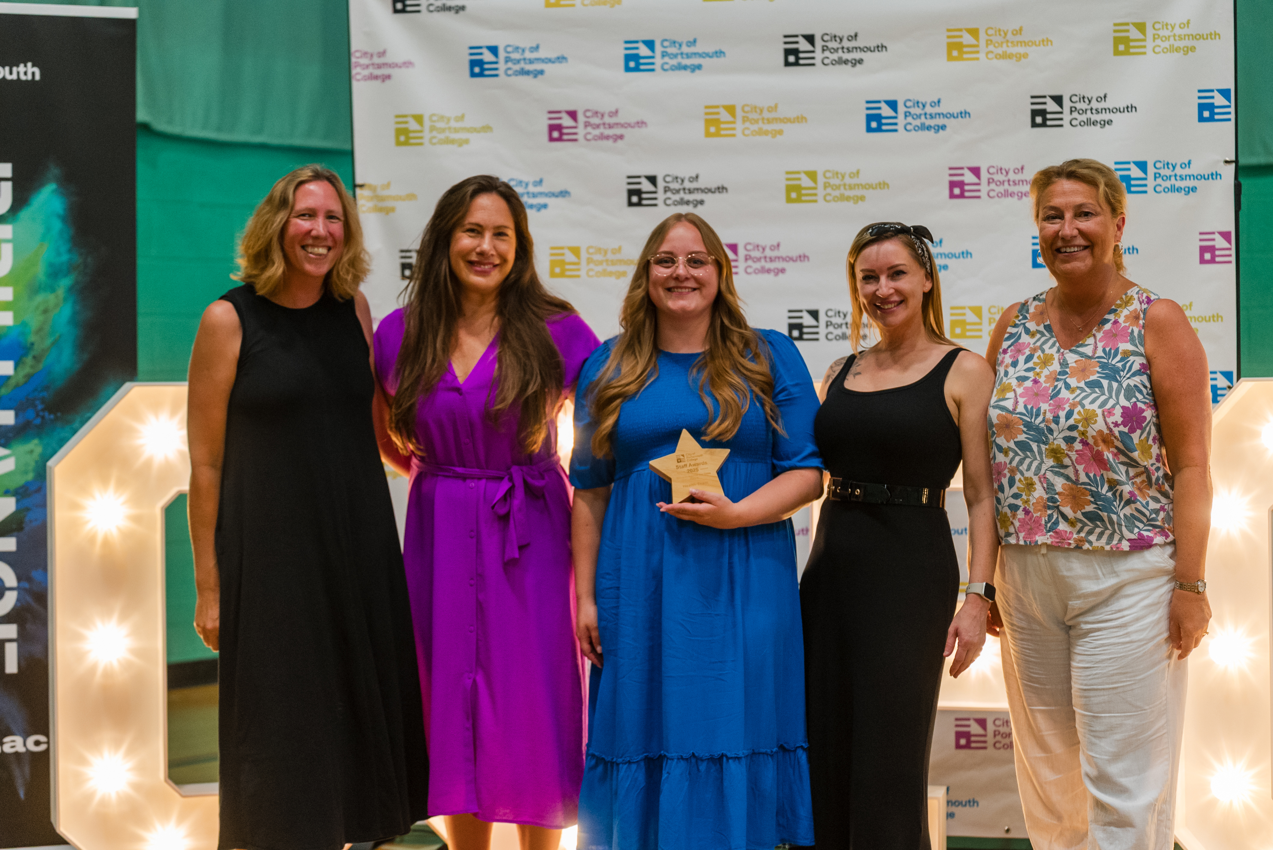 Four award winners standing with Katy Quinn, Principal of City of Portsmouth College at the Staff Awards