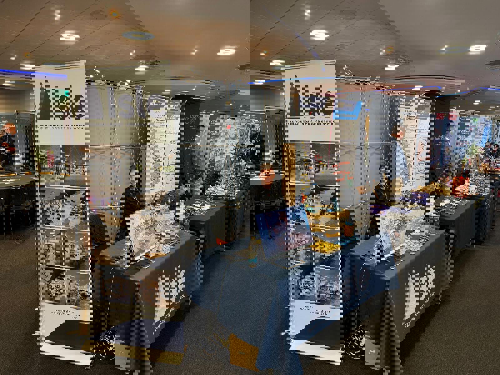 A property maintenance apprentice from COPC at a trade show for Isle Contracts 