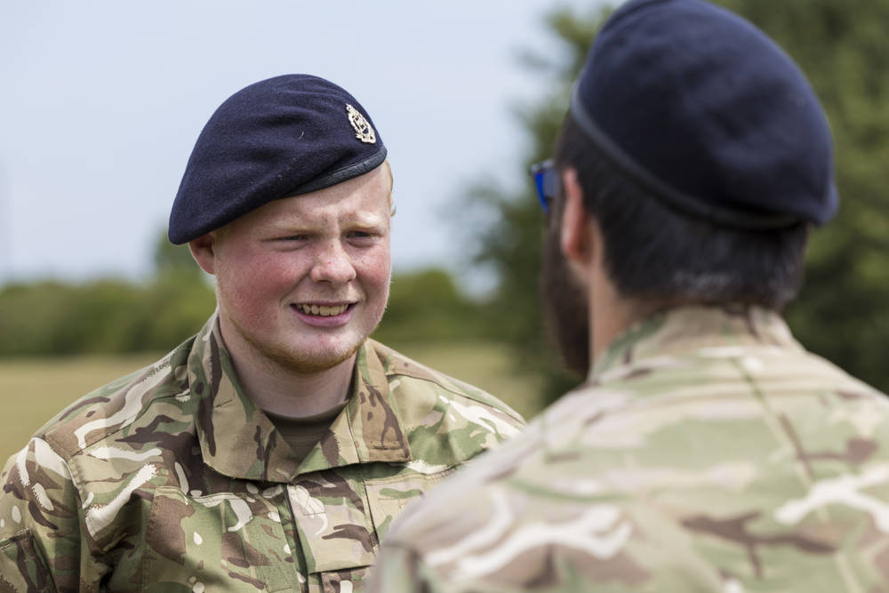 A male student dressed in an army uniform training in a UPS programme 