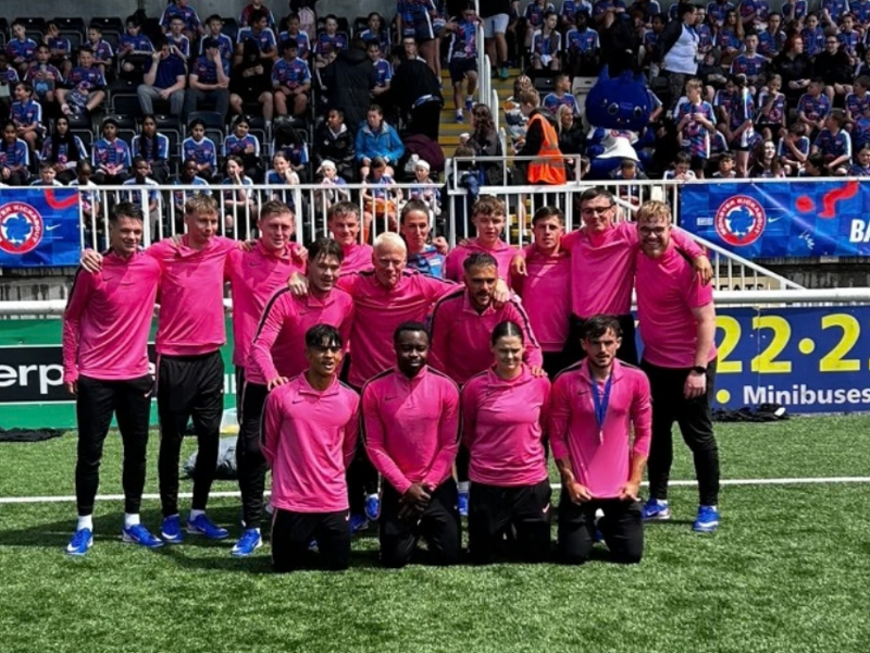 City of Portsmouth College staff and students pose for a team photo at the Monster Kickabout Tour 2026 alongside England football legend Jill Scott