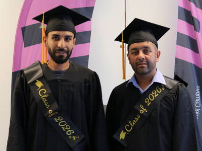 Two graduates from Level 2 ESOL