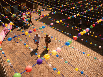 Victorious festivalgoers pictured enjoying the day, under a canopy of colourful balls