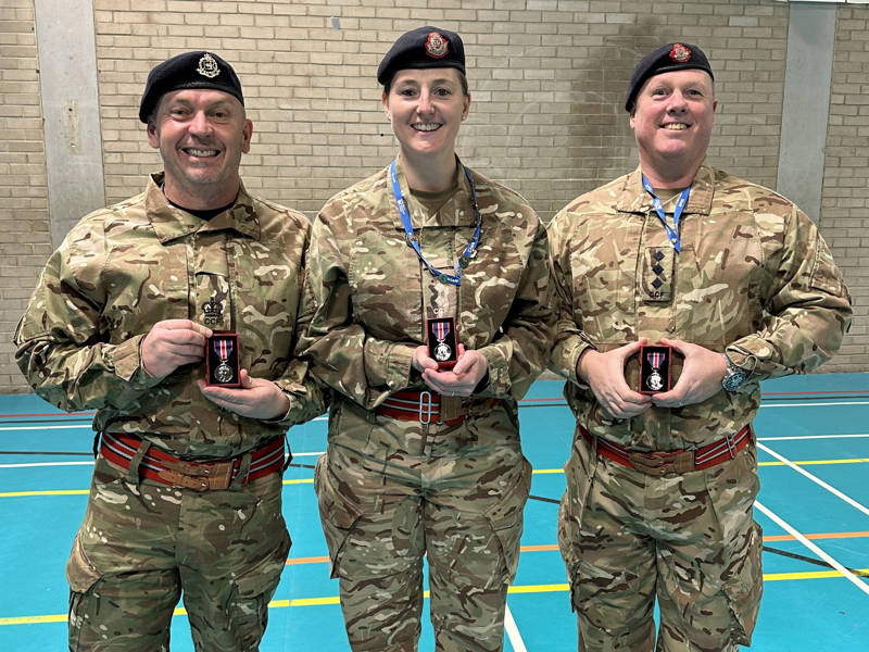 COPC Combined Cadet Force leaders Dean, Sophie and Javon seen with their King's Coronation Medals.