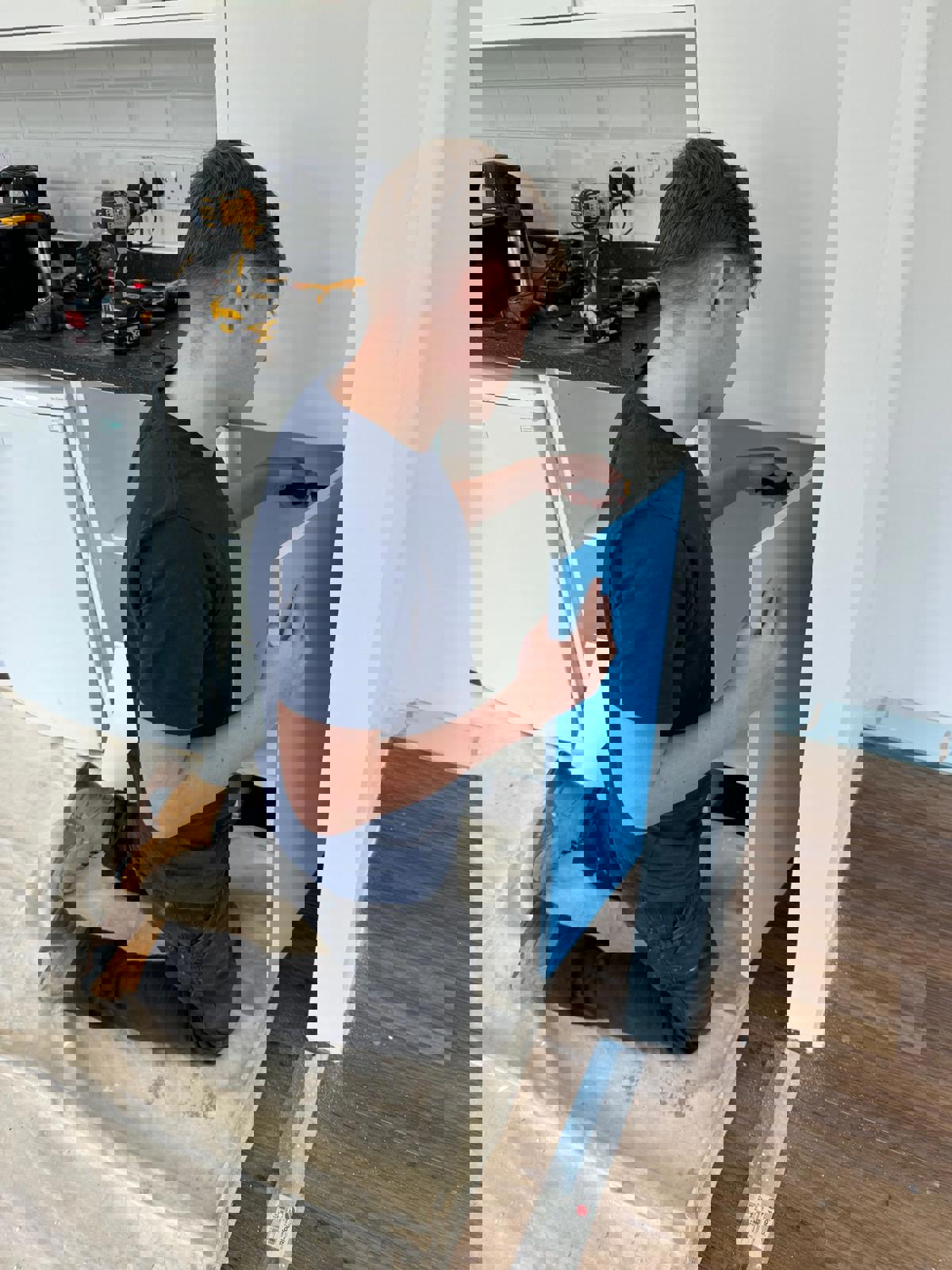 A young property maintenance apprentice from City of Portsmouth College at work