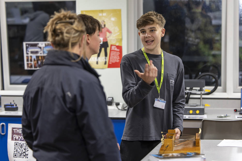 A current student sharing their experience with prospective students and their family during a City of Portsmouth College Open Event.