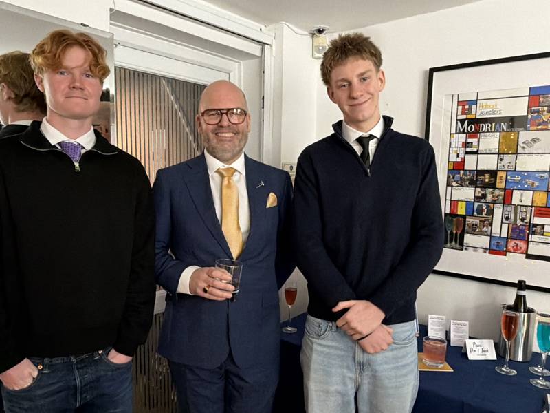 COPC students Olly Nash and Sam Woodage, with Hallmark Jewellers founder Mark Hussey between them